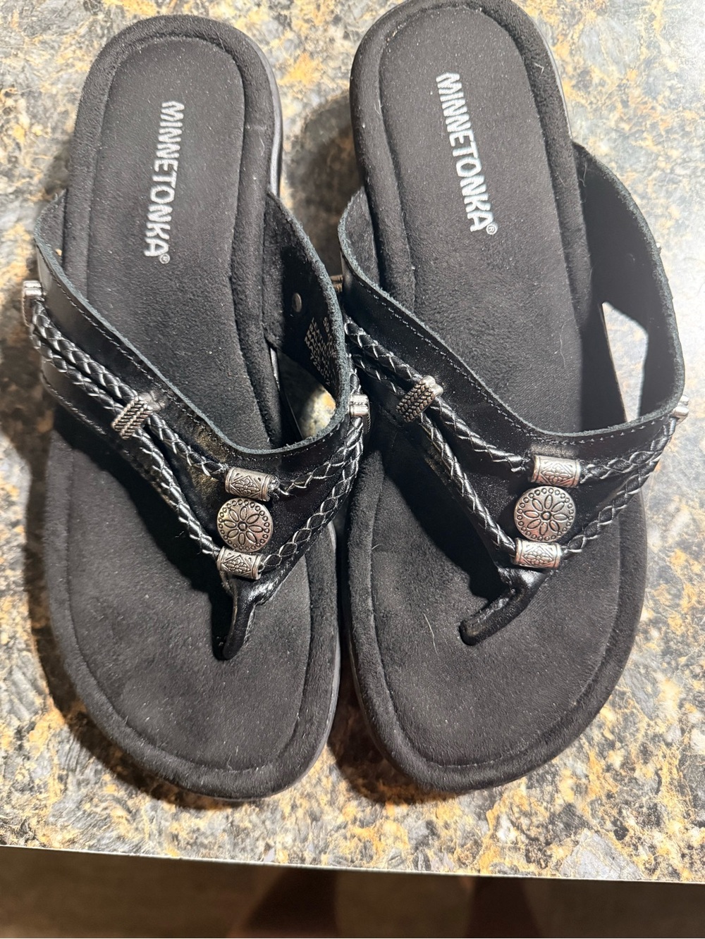 Minnetonka Black Braided Toe-Post Sandals with Decorative Medallions